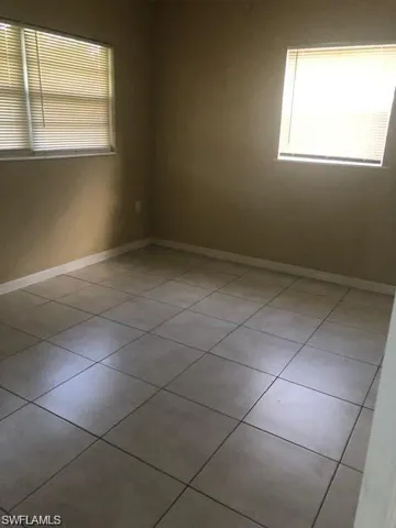 Spare room with tile floors