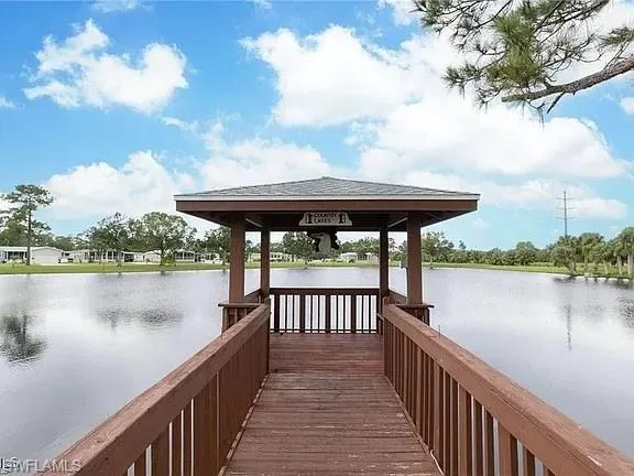 Dock area featuring a gazebo and a water view