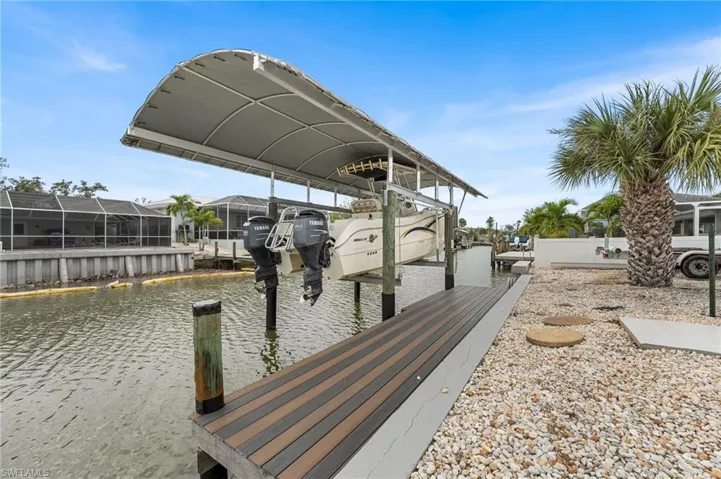 Single story home featuring concrete driveway, stucco siding, a garage, and a shingled roof