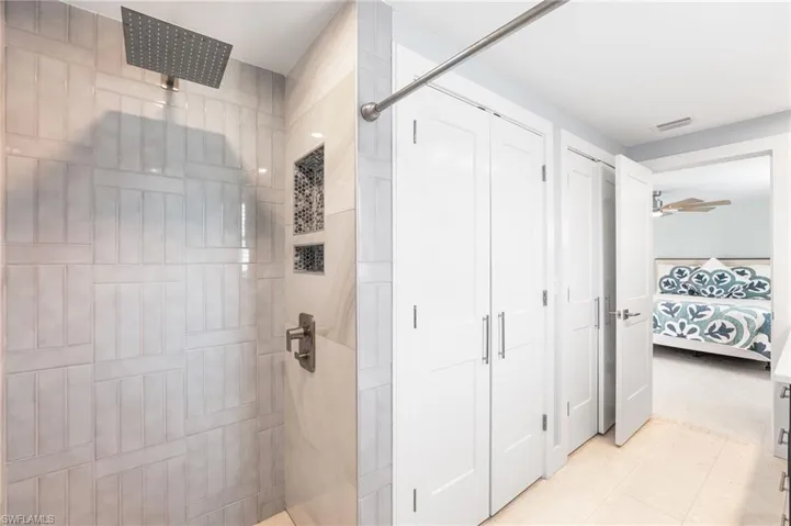 Guest Bathroom with a tile showers, vanity with vessel sink, and recessed lighting.  Handicap shower with easy access