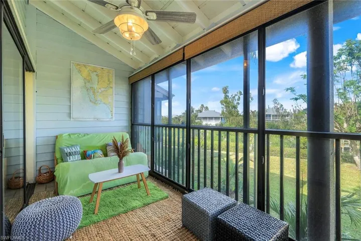 Sunroom featuring vaulted ceiling and ceiling fan