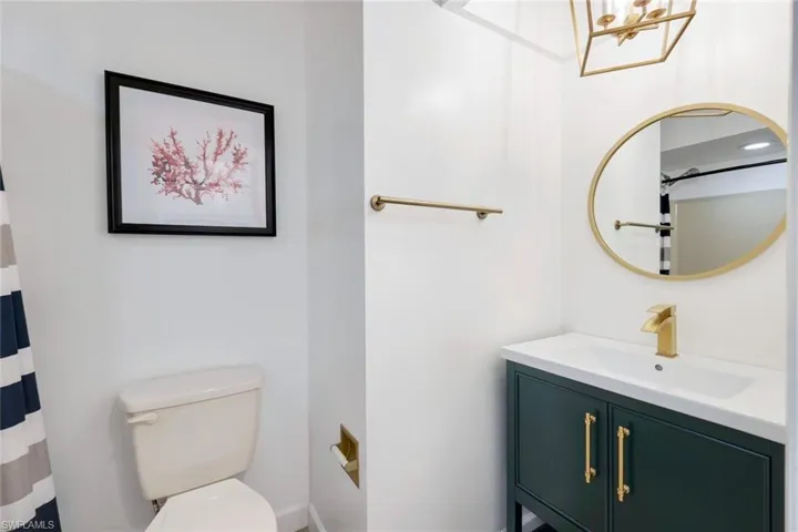 Bathroom featuring vanity and toilet