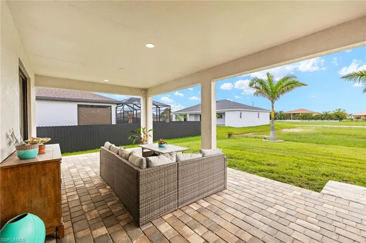 Wooden deck with a patio, outdoor lounge area, and a residential view
