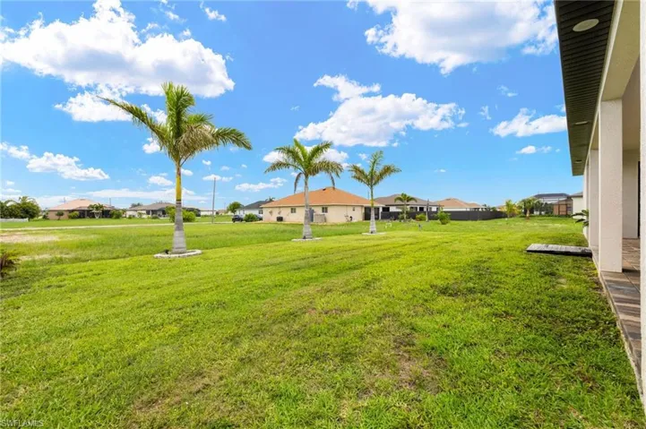 View of grassy yard with a residential view