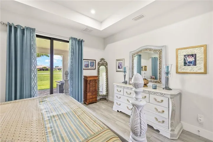 Bedroom featuring access to exterior and light wood finished floors