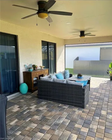 View of patio / terrace featuring ceiling fan and an outdoor hangout area