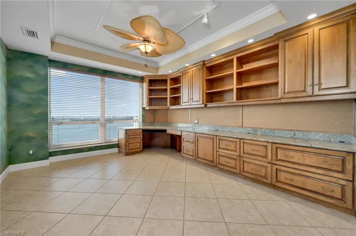 Beautiful built-ins in the study/office with large picturesque window for pausing