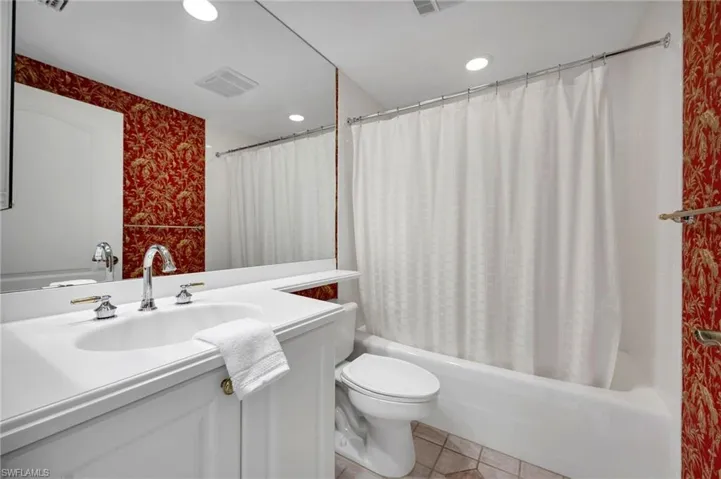Guest bathroom with tub/shower combination.