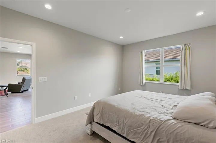 Bedroom featuring recessed lighting and carpet floors