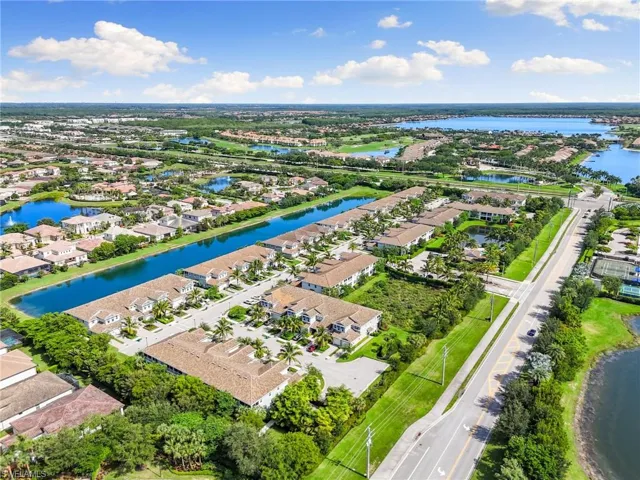 Aerial overview of property's location featuring nearby suburban area and a nearby body of water