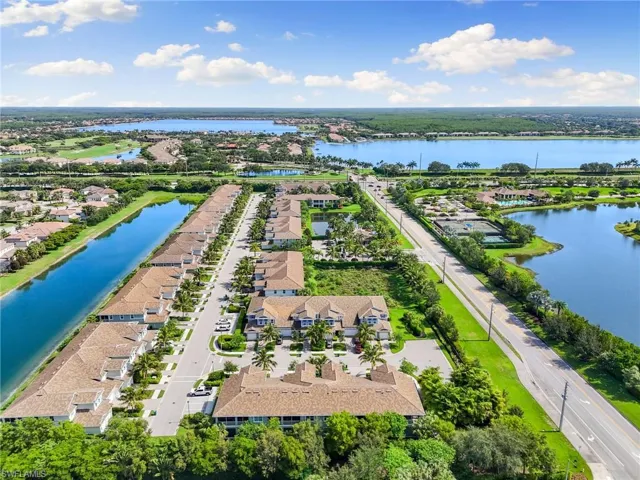 Aerial view of residential area featuring a large body of water