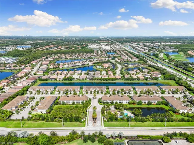 Aerial perspective of suburban area with a nearby body of water