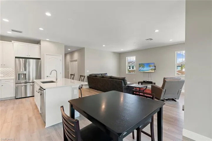 Dining space featuring light wood-type flooring and recessed lighting