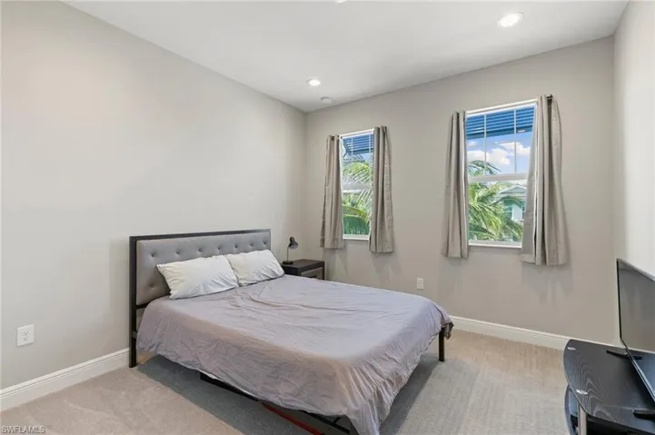 Carpeted bedroom featuring recessed lighting