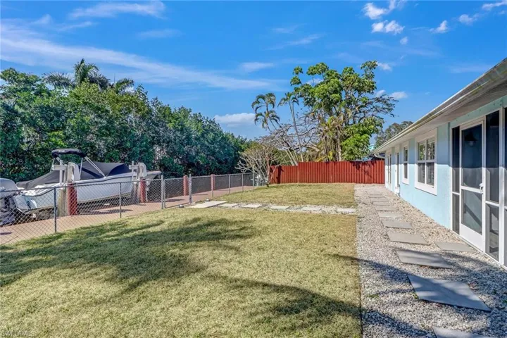 View of fenced backyard