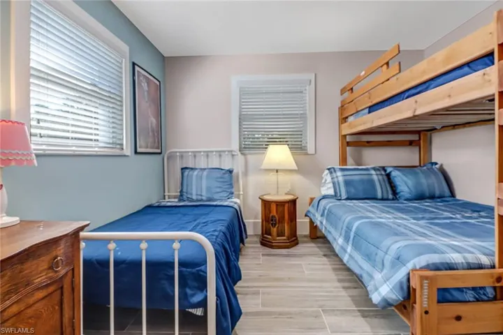 Bedroom featuring wood tiled floors