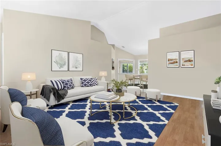 Large great room with vaulted ceilings.  Virtually staged photo