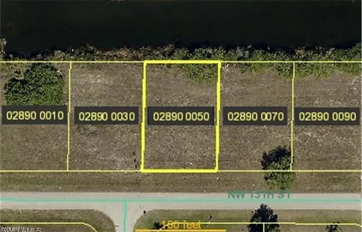 Aerial map of property and surrounding area featuring property boundaries highlighted