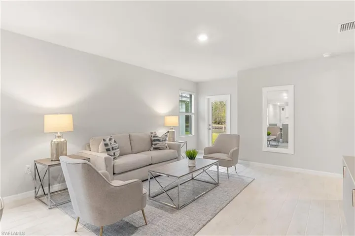 Living room with light wood-type flooring