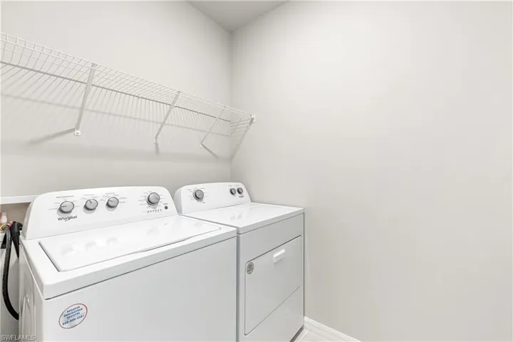 Clothes washing area with washing machine and clothes dryer