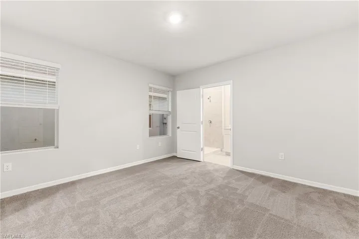 Spare room with light colored carpet