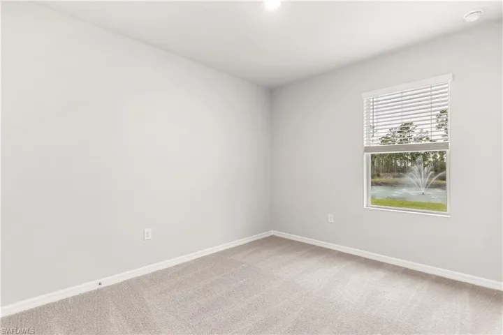 Empty room featuring carpet floors