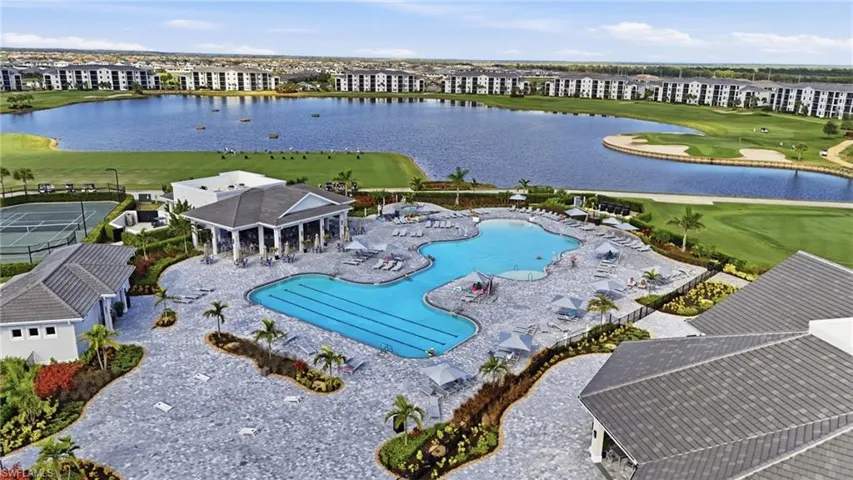 Aerial view of apartment complex / building and a golf course