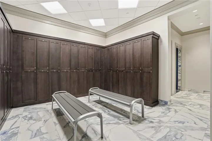 Misc room featuring a paneled ceiling and crown molding