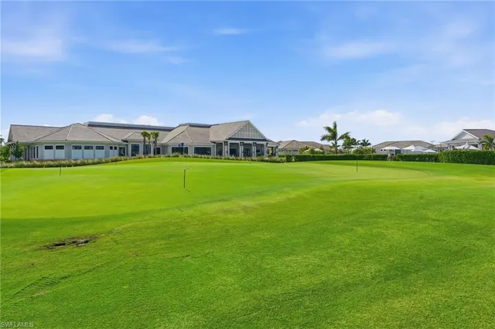 View of community featuring view of golf course and a putting area