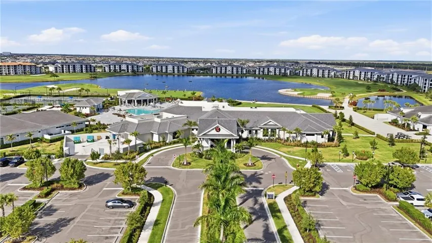 Aerial view of property's location with a large body of water and apartment complex
