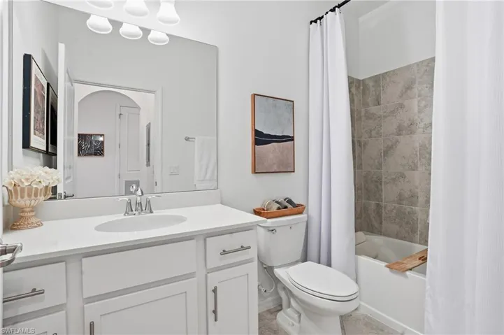 Full bath with shower / tub combo and vanity