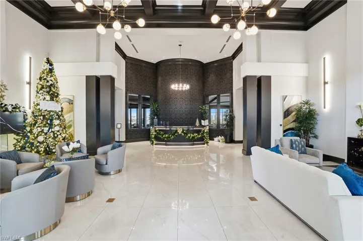 Lobby featuring a towering ceiling and ornamental molding