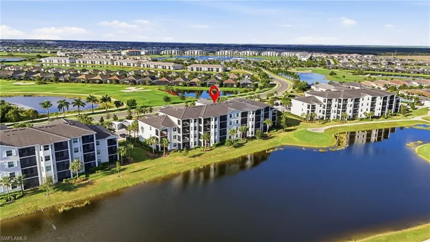 Drone / aerial view of a golf club and a nearby body of water