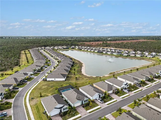 Aerial overview of property's location with nearby suburban area and a nearby body of water