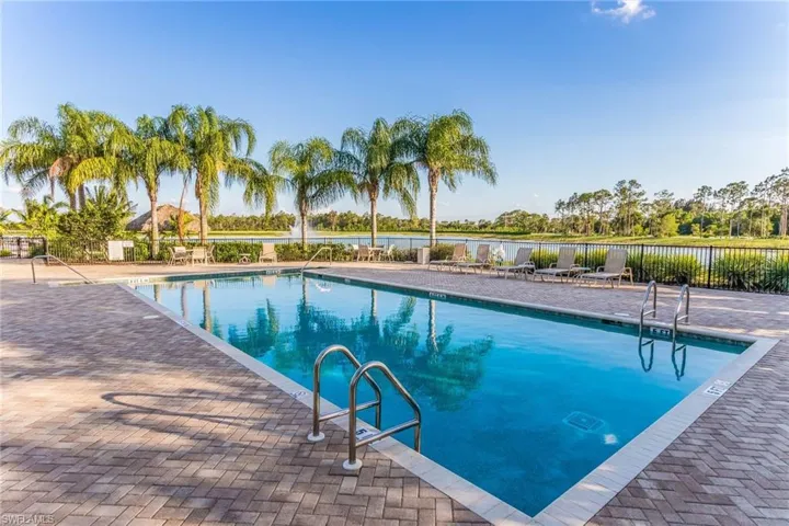 Community pool featuring a patio