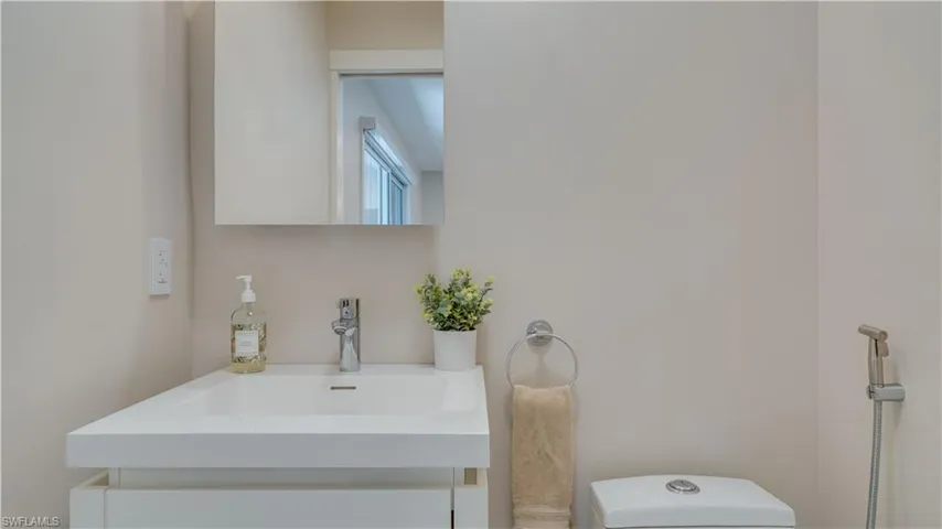Half bath featuring vanity and toilet