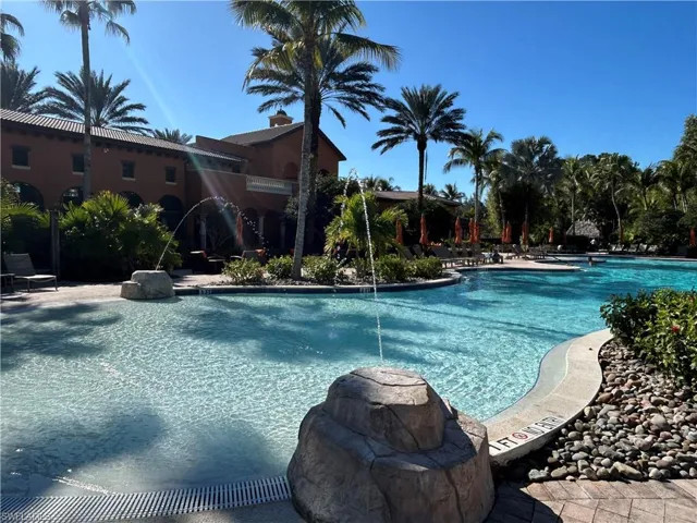 Community pool featuring a patio