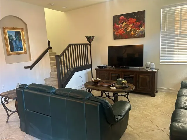Living area featuring light tile patterned flooring