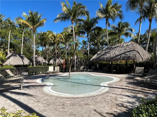 Community pool featuring a patio