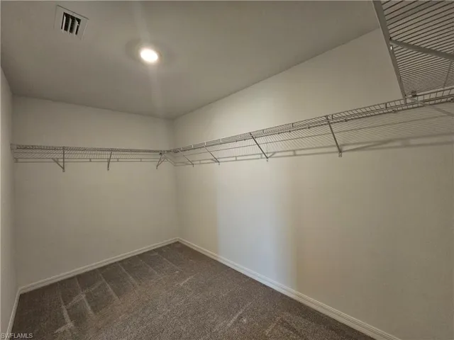 Extra large master closet with racks all the way around!