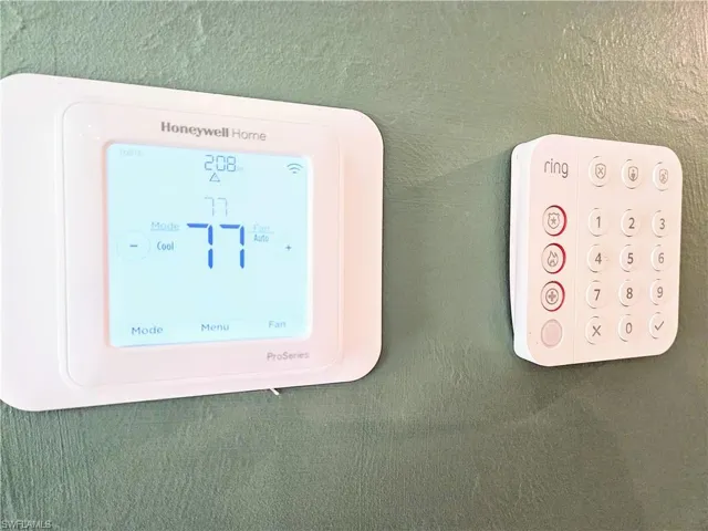 Smart Honeywell thermostat with app capability from anywhere! Ring home security system and doorbell!