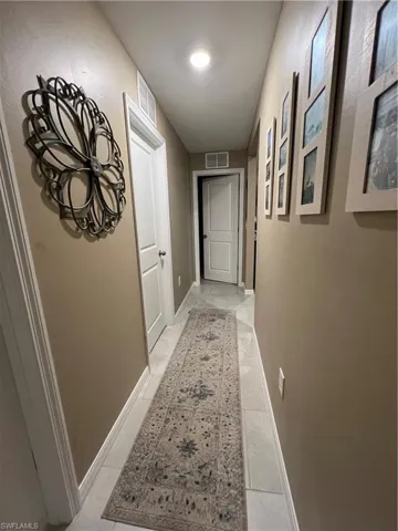 Separate long hallway to 3 extra bedrooms and plenty of room for all your family photos!