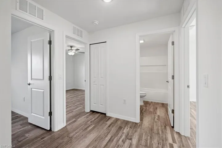 Corridor with wood-type flooring