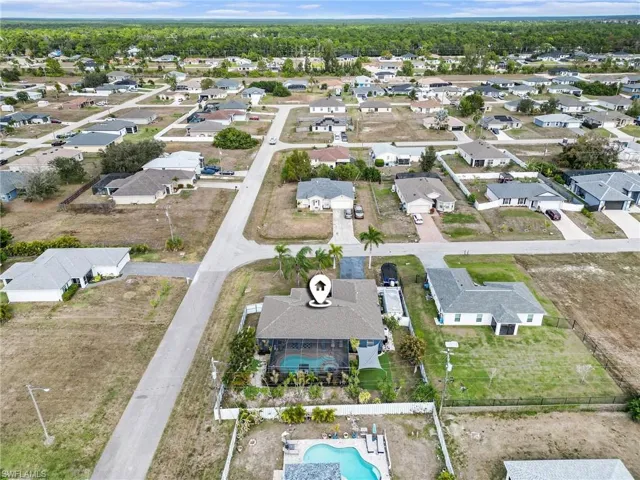 Aerial overview of property's location featuring nearby suburban area