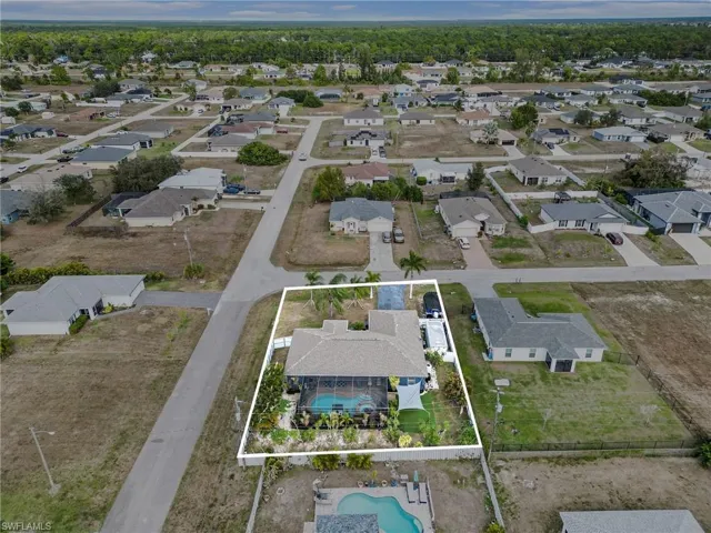 View of property location featuring property parcel outlined and nearby suburban area