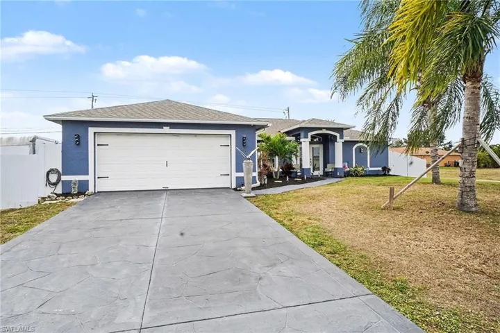 Single story home featuring stucco siding and driveway