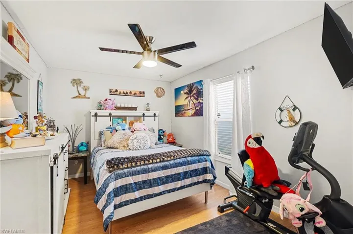 Bedroom featuring light wood finished floors and ceiling fan
