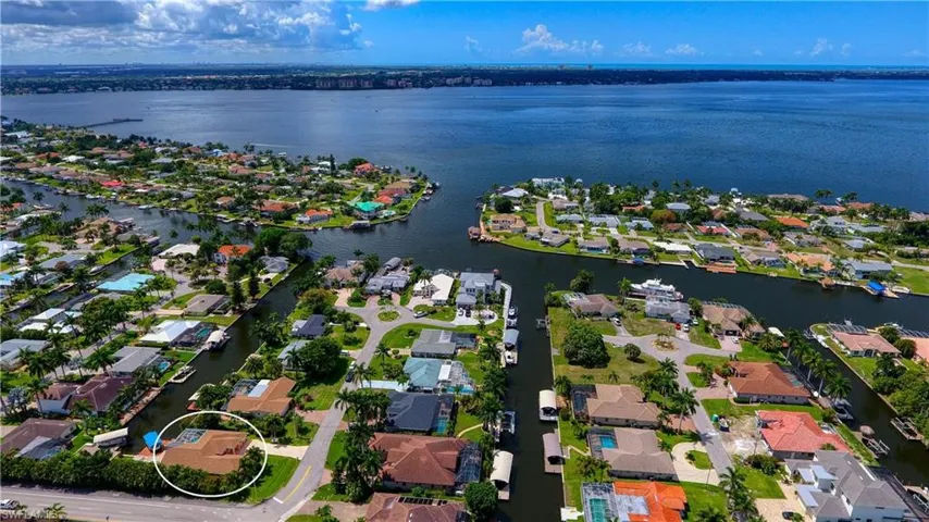 View of property location with nearby suburban area and a nearby body of water