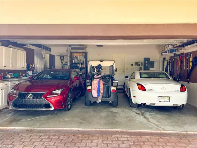 Oversize garage is large enough to hold 2 cars and a golf cart, and still plenty of cabinet storage space.