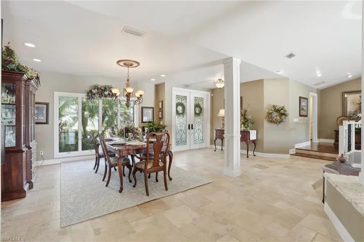Formal dining area is light, bright and open. Features Travertine floors and recessed lighting.